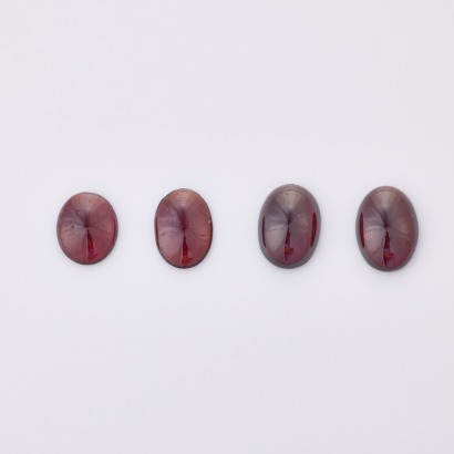 Parcel of Four, Cabochon Cut Oval Garnets totalling 23.60cts