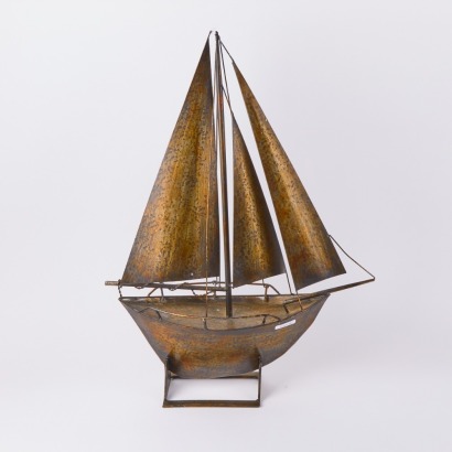 A Large Metal Boat On Stand