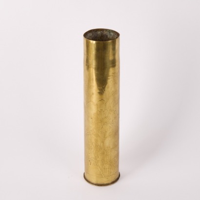 A Brass Bullet Casing With Floral Etching