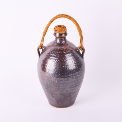 A Mirek Smisek Salt Glazed Wine Carrier with Cane Handle