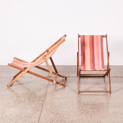 A Pair Of Teak Deck Chairs