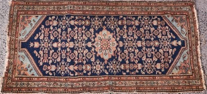 An Antique Hand Knotted Persian Rug