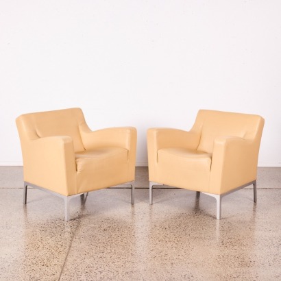 A Pair of Beige Vinyl Chairs