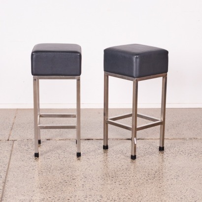 A Pair Of Stainless And Black Upholstery Barstools