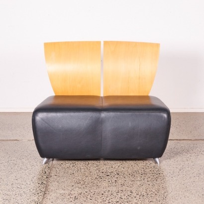 A Minimal Two Seater Couch With Formed Ply Backrest