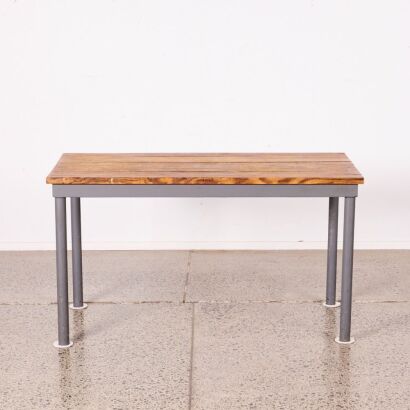 An Industrial Table with Cast Iron Legs