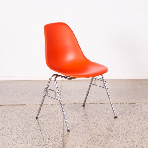 An Eames DSS Chair In Orange