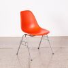 An Eames DSS Chair In Orange
