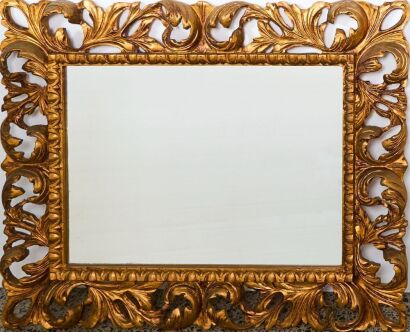 An Ornate Wooden Framed Mirror