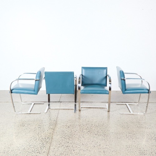 A Set Of Four Post Modern Cantilever Chairs