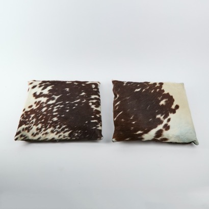 A Pair Of Cow Hide Cushions