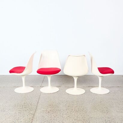 A Set Of Four Tulip Style Chairs