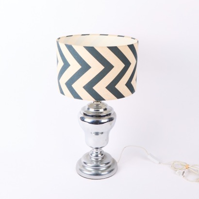 A Single Metal Table Lamp With Zig Zag Shade