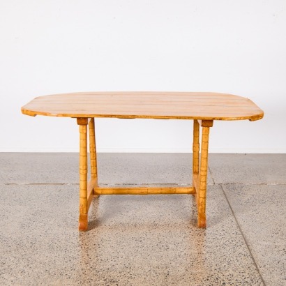 A Timber Dining Table with Bamboo Look Legs