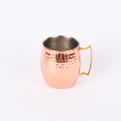 A Beaten Mug with Copper Exterior