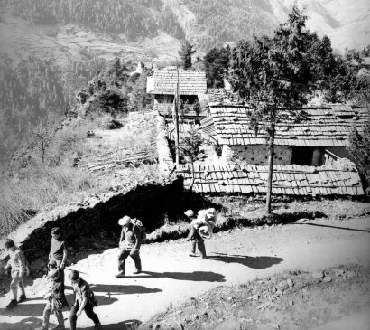 The Party Walking Past Monks Houses as They Approach